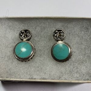 Vintage Sterling Silver earrings with a turquoise stone. 3/4 inch long